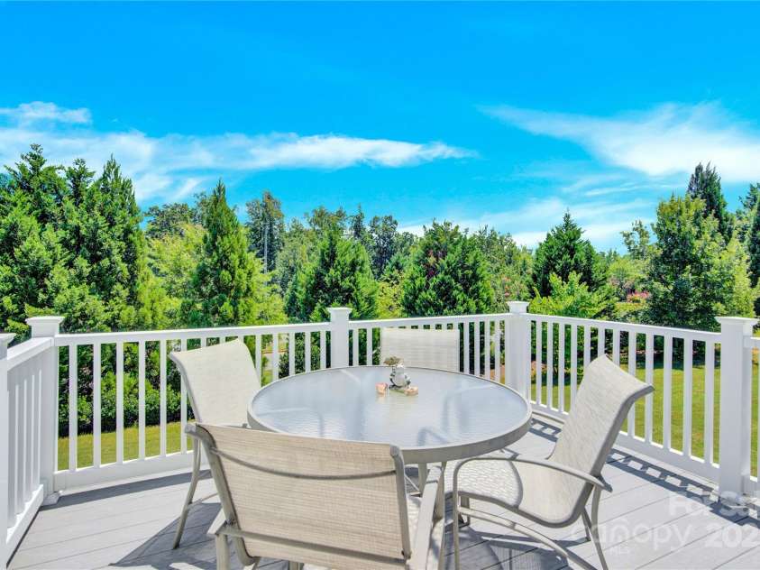7028 Kitty Hawk Lane, Fort Mill, SC 29707.  MLS# CAR4285011, YatesRealty ID 30903. Deck off the sunroom. You feel like you're in the mountains!