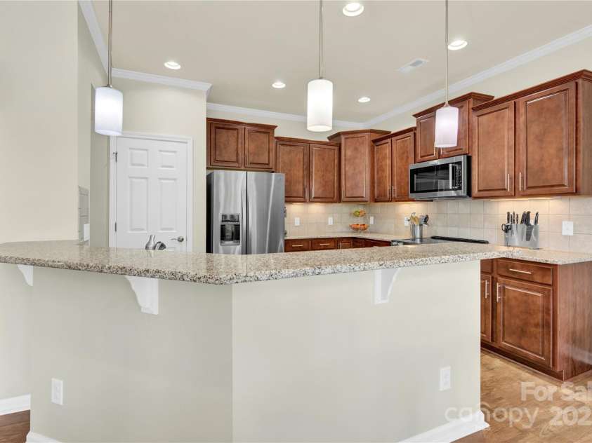 7028 Kitty Hawk Lane, Fort Mill, SC 29707.  MLS# CAR4285011, YatesRealty ID 30903. Eat-in Bar with pendent lights.