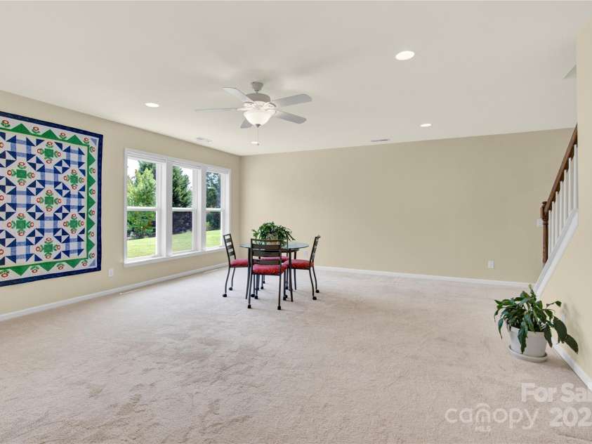 7028 Kitty Hawk Lane, Fort Mill, SC 29707.  MLS# CAR4285011, YatesRealty ID 30903. Huge Great room in basement.