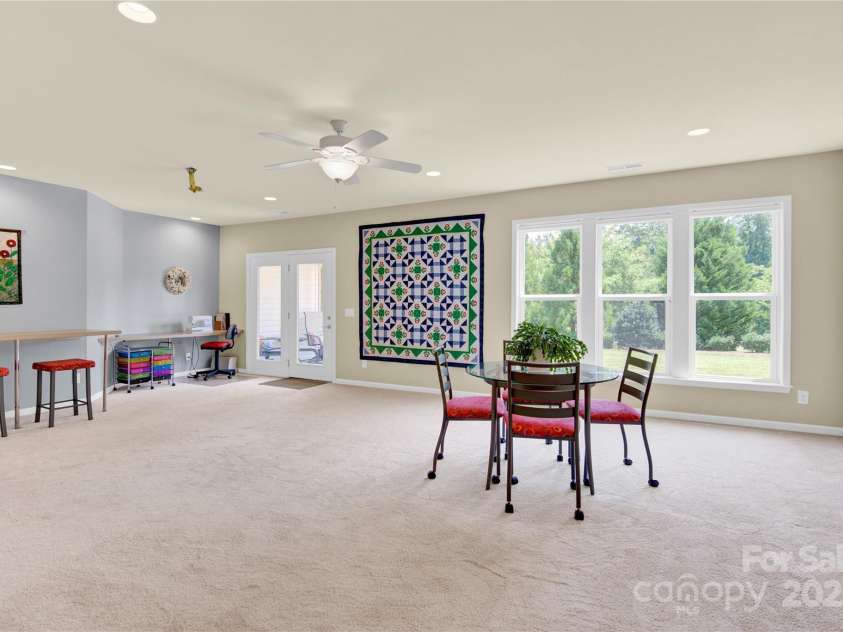 7028 Kitty Hawk Lane, Fort Mill, SC 29707.  MLS# CAR4285011, YatesRealty ID 30903. Large, light-filled Great/Bonus Room as you enter downstairs.