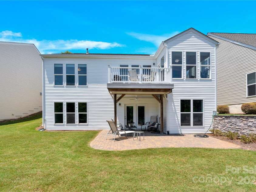 7028 Kitty Hawk Lane, Fort Mill, SC 29707.  MLS# CAR4285011, YatesRealty ID 30903. Rear of home. Perfect entertaining areas on the main level and also off the lower level.