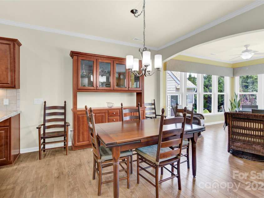 7028 Kitty Hawk Lane, Fort Mill, SC 29707.  MLS# CAR4285011, YatesRealty ID 30903. Separate Dining Area that flows into the Sunroom.