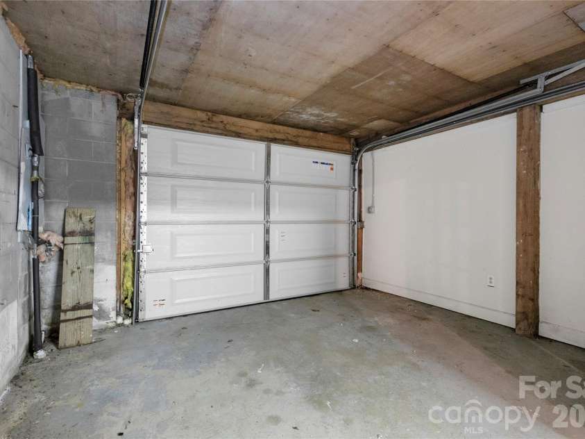 56 Guque Court, Brevard, NC 28712.  MLS# CAR4391612, YatesRealty ID 30909. Attached Basement Single Garage. Would make a great workshop area.