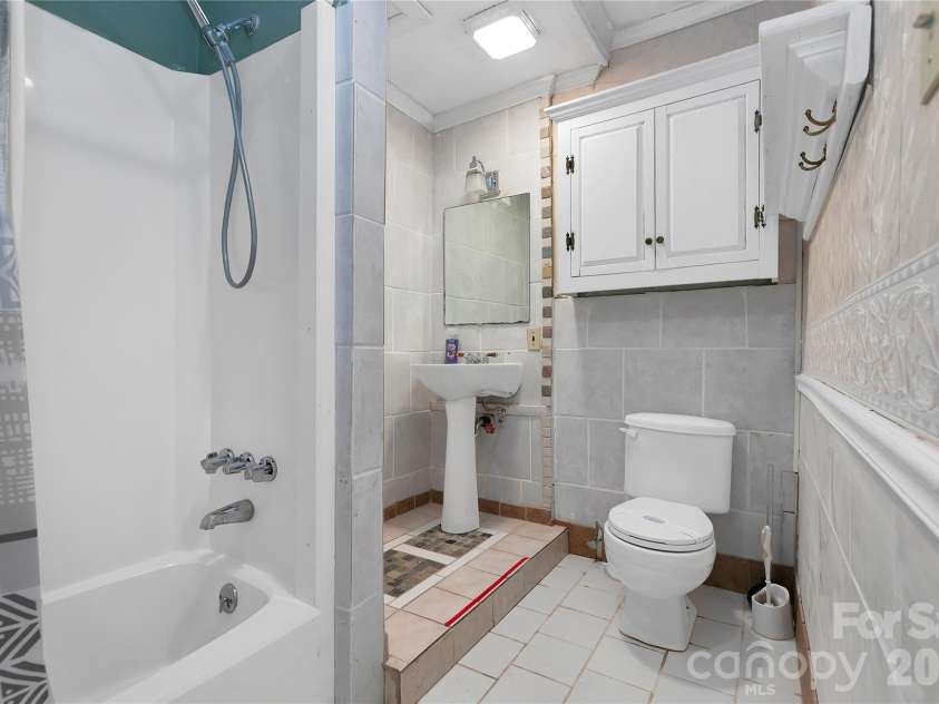 56 Guque Court, Brevard, NC 28712.  MLS# CAR4391612, YatesRealty ID 30909. Downstairs Full Bathroom.
