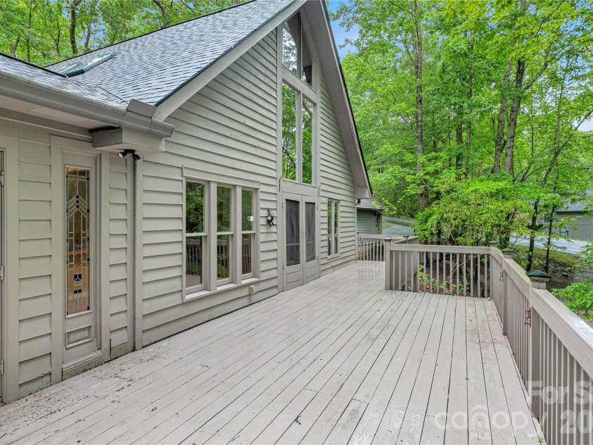 56 Guque Court, Brevard, NC 28712.  MLS# CAR4391612, YatesRealty ID 30909. Expansive Deck