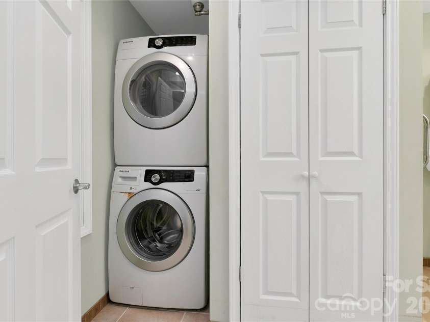 56 Guque Court, Brevard, NC 28712.  MLS# CAR4391612, YatesRealty ID 30909. Laundry in Primary Bathroom