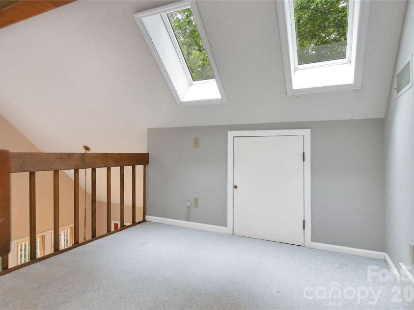 56 Guque Court, Brevard, NC 28712.  MLS# CAR4391612, YatesRealty ID 30909. Loft includes new skylights.