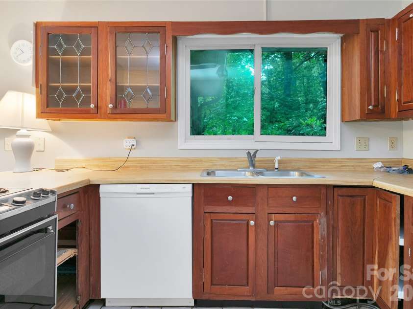 56 Guque Court, Brevard, NC 28712.  MLS# CAR4391612, YatesRealty ID 30909. This Kitchen area is looking for your vision.