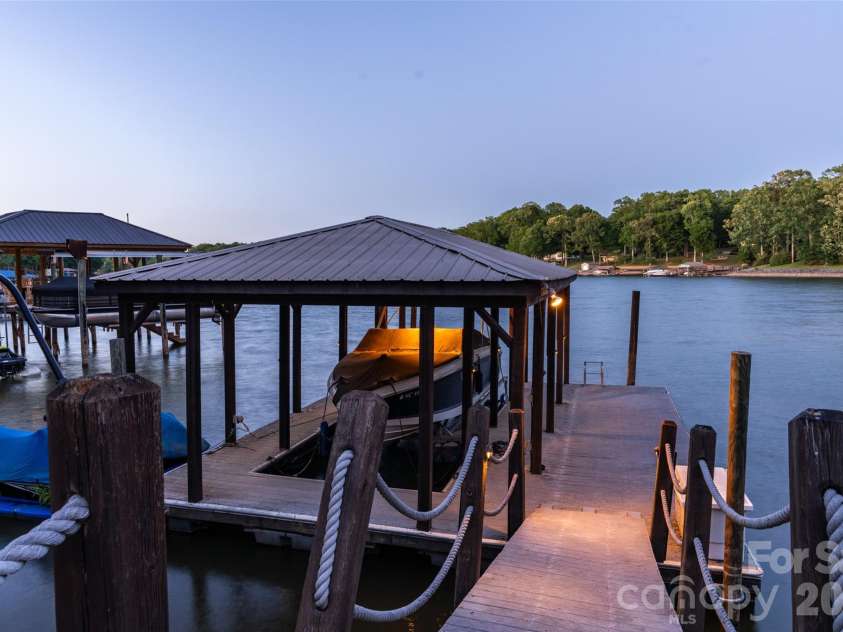1440 Langdon Road, Sherrills Ford, NC 28673.  MLS# CAR4382448, YatesRealty ID 30910. Dock at twilight