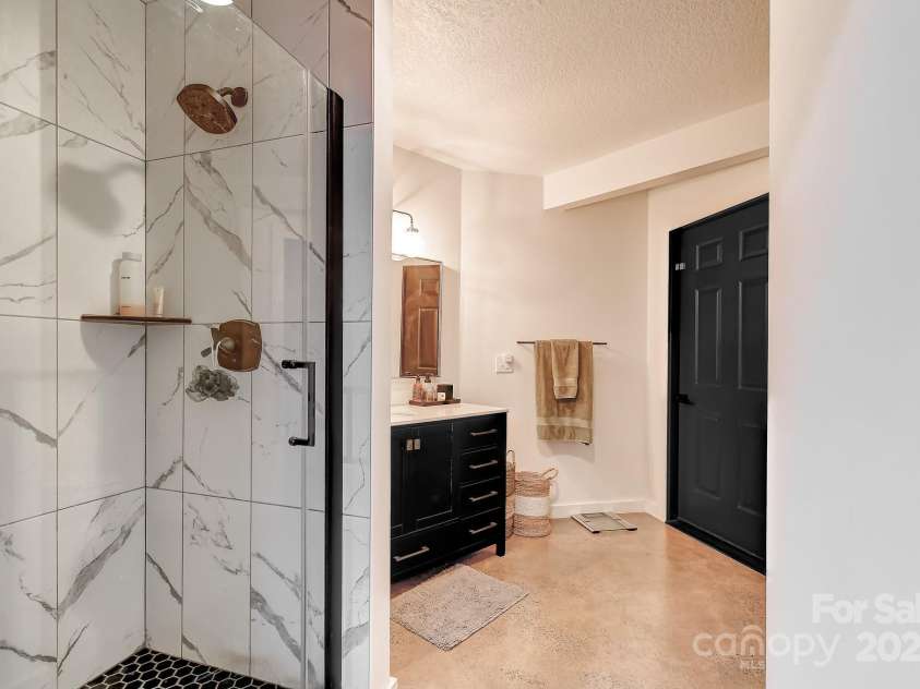 169 Pickens Road, Weaverville, NC 28787.  MLS# CAR4281406, YatesRealty ID 30910. Downstairs full bathroom