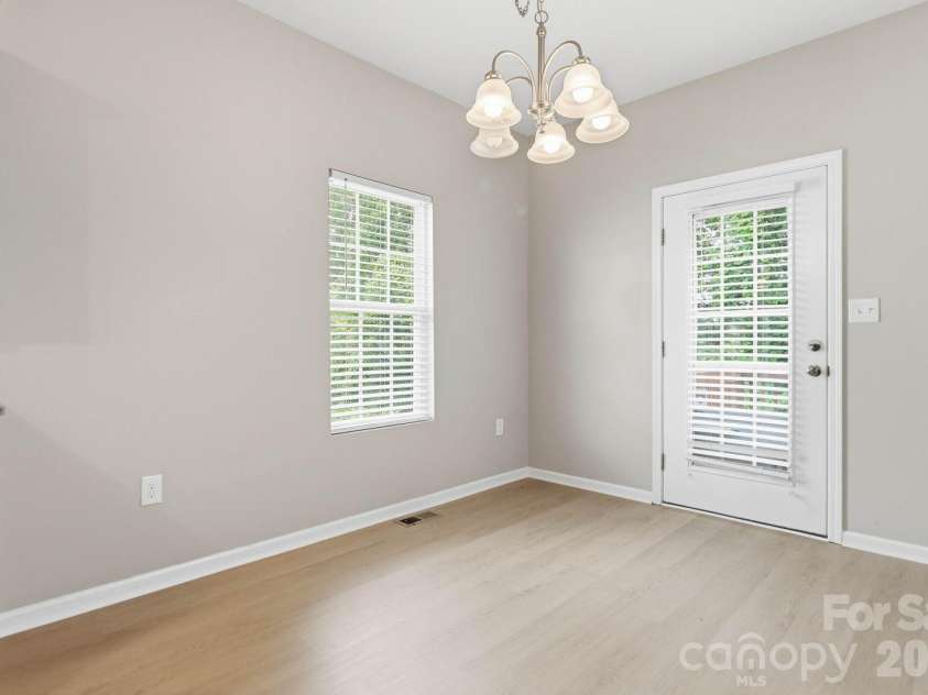 143 High Bluff Circle, Mooresville, NC 28115.  MLS# CAR4391927, YatesRealty ID 30918. Dining Area Leads to Deck