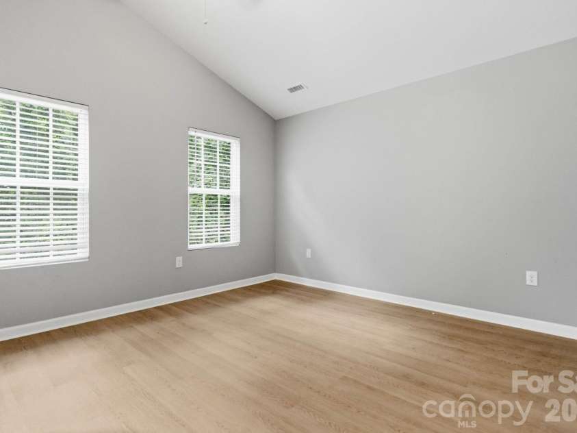 143 High Bluff Circle, Mooresville, NC 28115.  MLS# CAR4391927, YatesRealty ID 30918. Primary Bedroom with Vaulted Ceiling