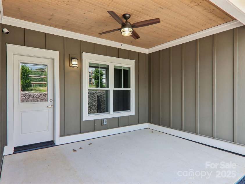 23 Cozy Cottage Way, Arden, NC 28704.  MLS# CAR4276854, YatesRealty ID 30919. Covered back porch