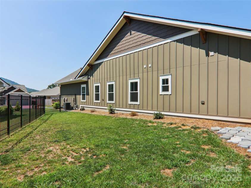 23 Cozy Cottage Way, Arden, NC 28704.  MLS# CAR4276854, YatesRealty ID 30919. Homeowner maintains this portion of the yard