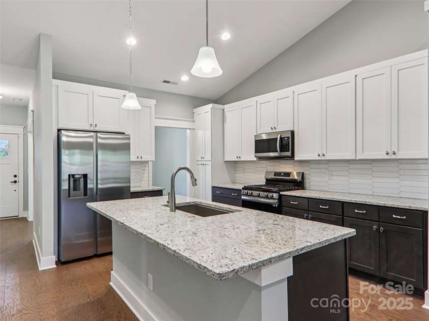 23 Cozy Cottage Way, Arden, NC 28704.  MLS# CAR4276854, YatesRealty ID 30919. Large island adds space and convenience