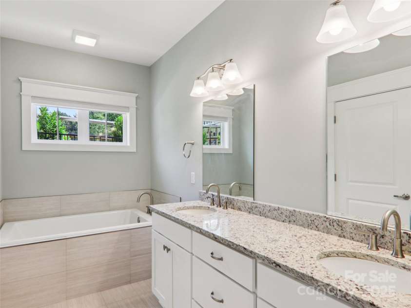 23 Cozy Cottage Way, Arden, NC 28704.  MLS# CAR4276854, YatesRealty ID 30919. Primary bath with large double vanity