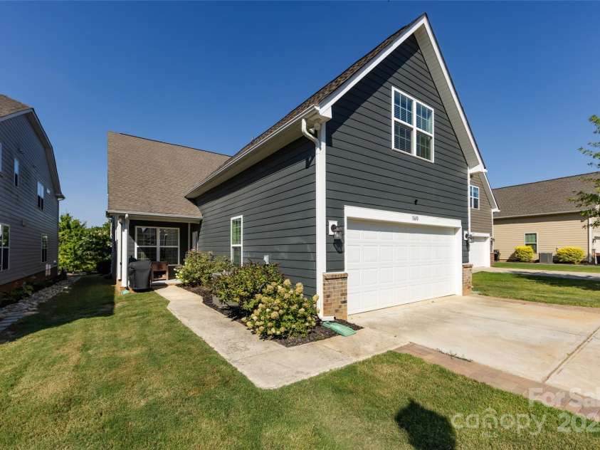 11610 Westbranch Parkway, Davidson, NC 28036.  MLS# CAR4281574, YatesRealty ID 30930. Back of the home with second rear entry and two-car garage