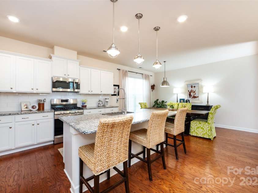 11610 Westbranch Parkway, Davidson, NC 28036.  MLS# CAR4281574, YatesRealty ID 30930. Well-lit, bright kitchen with pretty pendant lights over the island