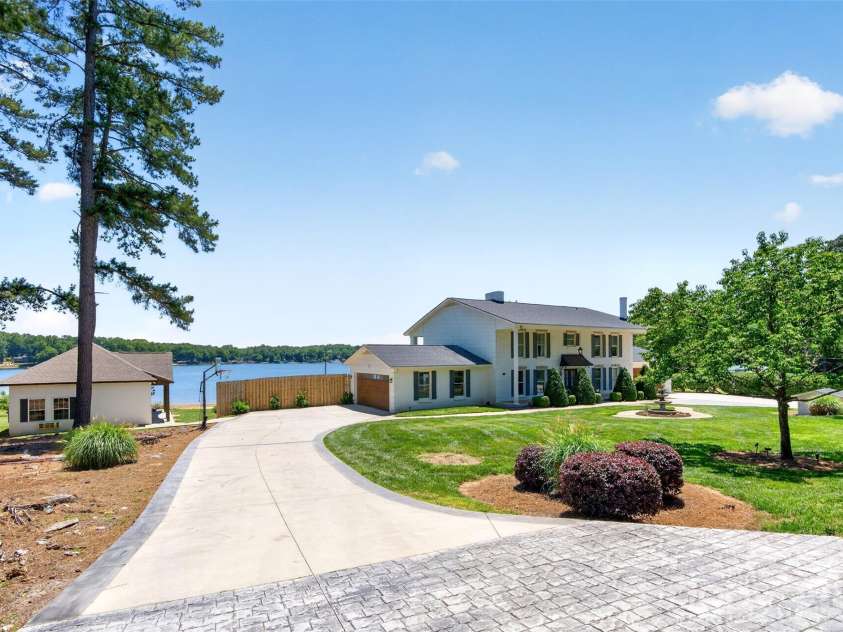 615 Kenway Loop, Mooresville, NC 28117.  MLS# CAR4390564, YatesRealty ID 30936. Front main house w/ pool home- driveway #2