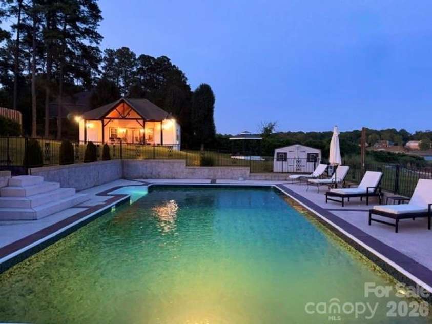 615 Kenway Loop, Mooresville, NC 28117.  MLS# CAR4390564, YatesRealty ID 30936. Night time pool n pool house