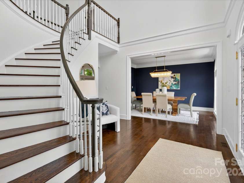7007 Golden Rain Court, Charlotte, NC 28277.  MLS# CAR4288408, YatesRealty ID 30936. Curved Staircase is a focal point and enchanting