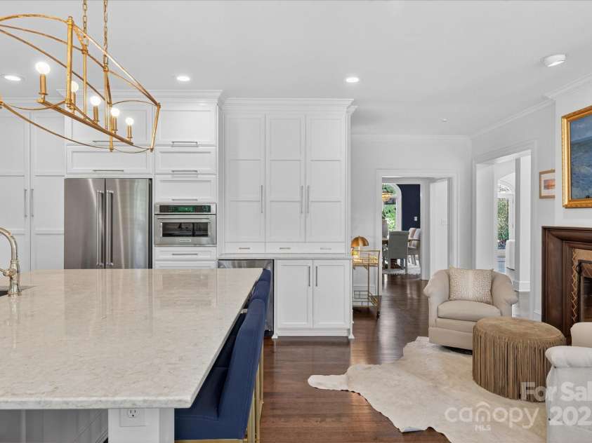 7007 Golden Rain Court, Charlotte, NC 28277.  MLS# CAR4288408, YatesRealty ID 30936. Easy access to Dining room from the Kitchen, and relax by the fireplace while you cook