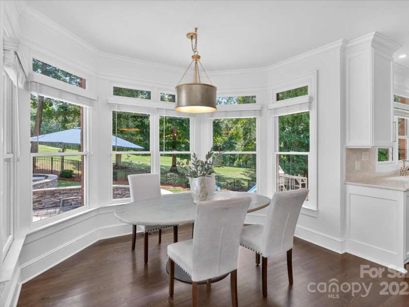 7007 Golden Rain Court, Charlotte, NC 28277.  MLS# CAR4288408, YatesRealty ID 30936. Look out over the backyard from the bay windows at your Breakfast table