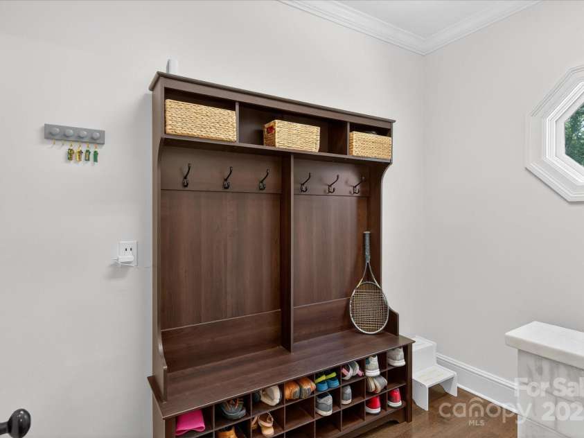 7007 Golden Rain Court, Charlotte, NC 28277.  MLS# CAR4288408, YatesRealty ID 30936. Mud Room equipped with drop zone cabinetry right off Garage entrance