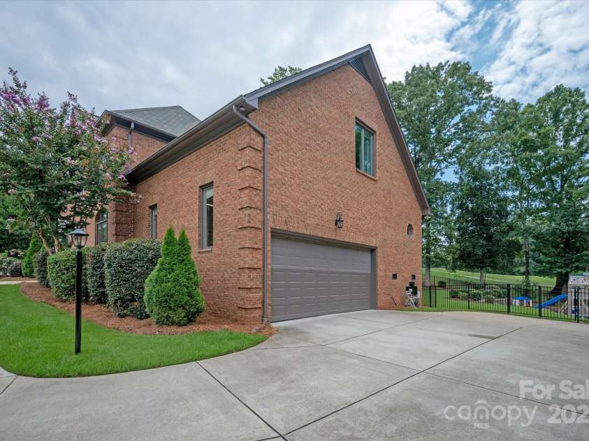 7007 Golden Rain Court, Charlotte, NC 28277.  MLS# CAR4288408, YatesRealty ID 30936. Side load 2-Car Garage with entry at the main level