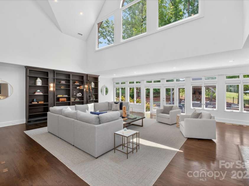 7007 Golden Rain Court, Charlotte, NC 28277.  MLS# CAR4288408, YatesRealty ID 30936. Two-story high Great Room with built-in Book case and sun drenched