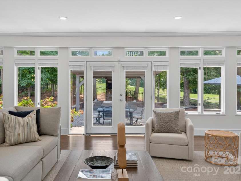 7007 Golden Rain Court, Charlotte, NC 28277.  MLS# CAR4288408, YatesRealty ID 30936. Wall of glass windows and doors for panoramic views of the backyard and the 13th Green