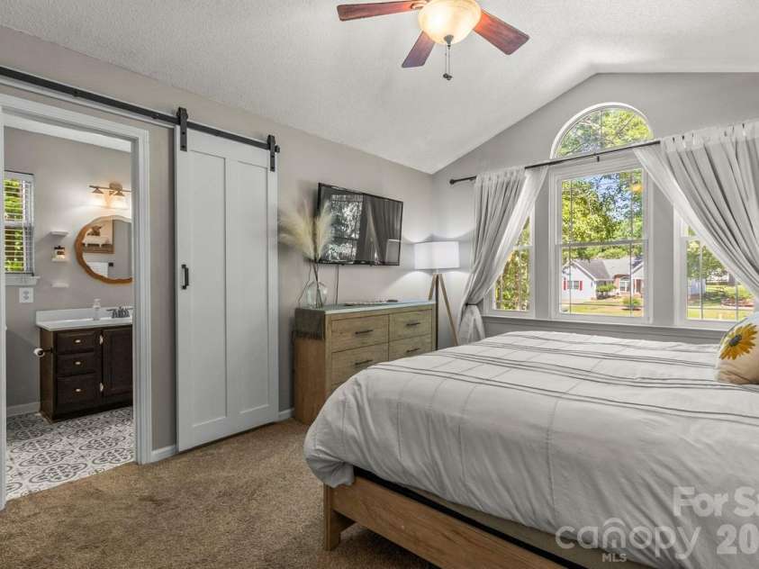 14018 Naworth Lane, Huntersville, NC 28078.  MLS# CAR4381106, YatesRealty ID 30939. Priimary Bedroom with great natural light and custom barndoor 