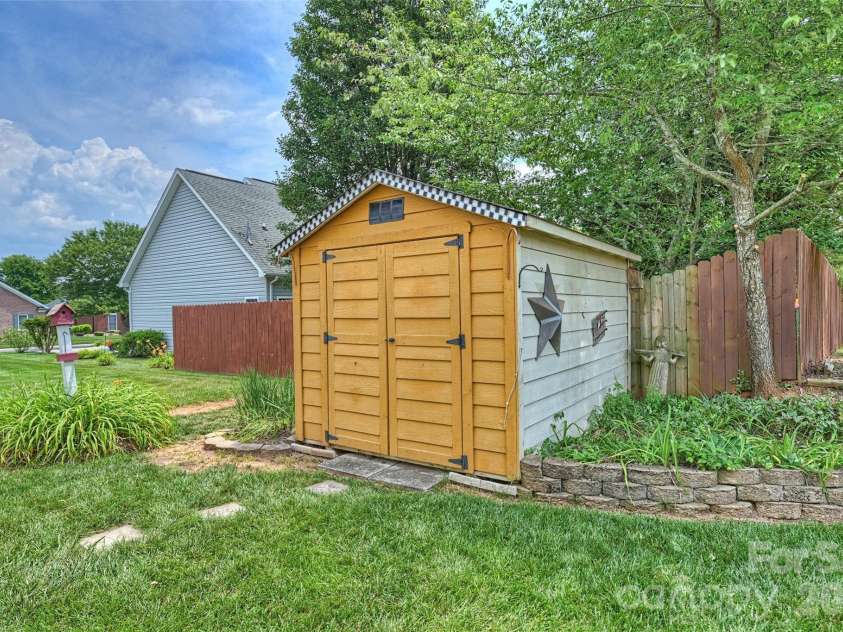 315 Wendover Drive, Locust, NC 28097.  MLS# CAR4391578, YatesRealty ID 30941. Storage Shed