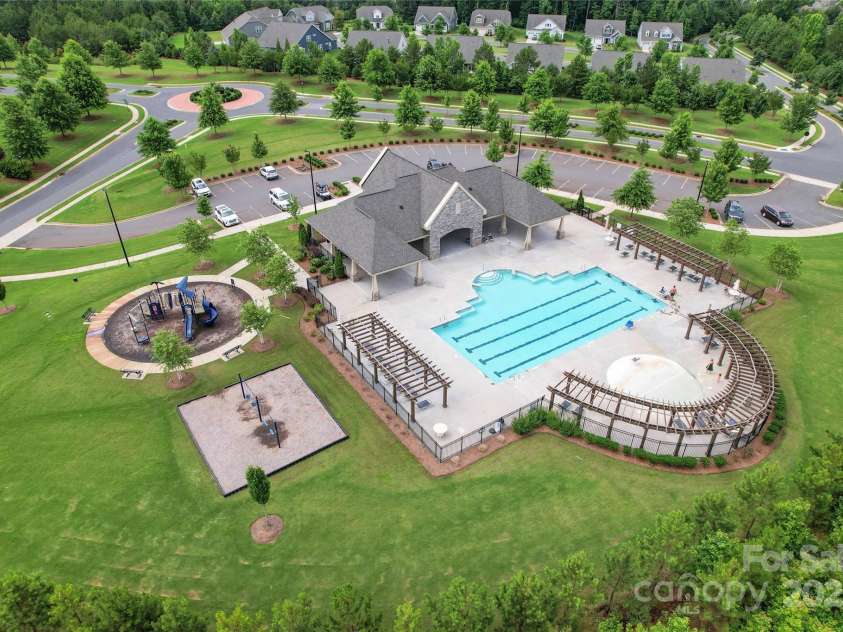 4008 Pinot Way, Fort Mill, SC 29707.  MLS# CAR4268803, YatesRealty ID 30944. Arial view of the clubhouse, pool, and playground facilities for the community.