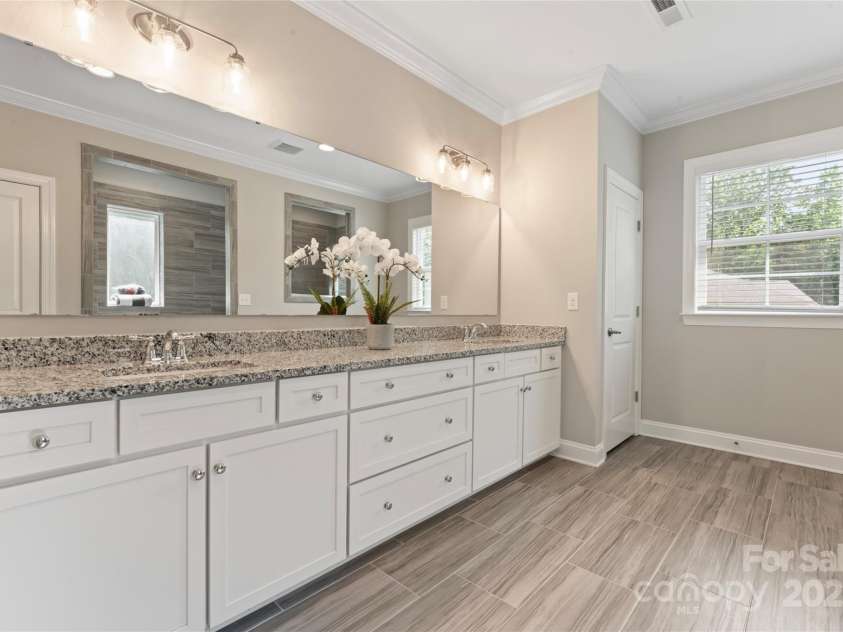 4008 Pinot Way, Fort Mill, SC 29707.  MLS# CAR4268803, YatesRealty ID 30944. Relax after a long day in your spacious owner's bath, with walk-through shower.