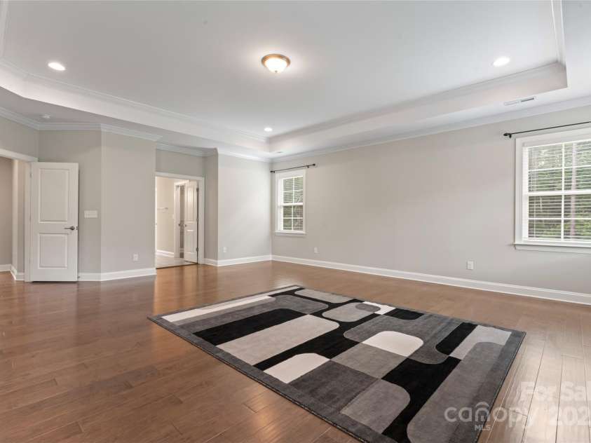 4008 Pinot Way, Fort Mill, SC 29707.  MLS# CAR4268803, YatesRealty ID 30944. Spacious primary suite with lighted tray ceiling.