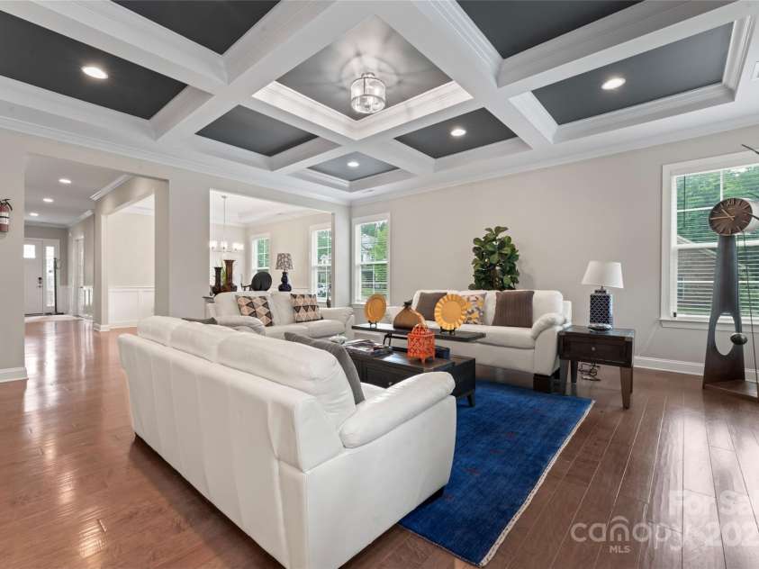 4008 Pinot Way, Fort Mill, SC 29707.  MLS# CAR4268803, YatesRealty ID 30944. Stunning living room with coffered ceilings, tastefully painted with a beautiful blue accent color.
