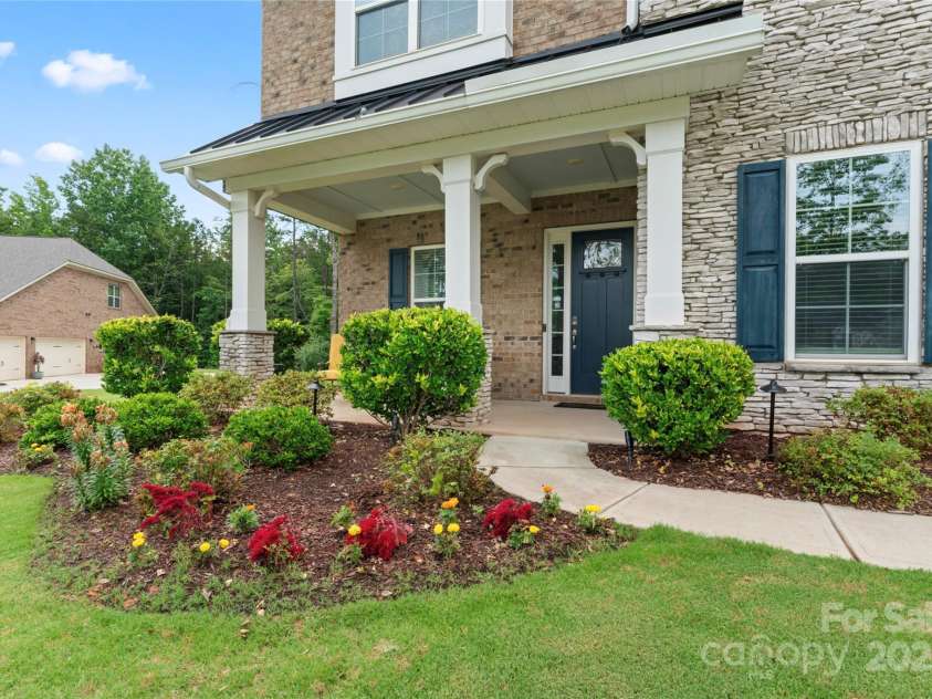 4008 Pinot Way, Fort Mill, SC 29707.  MLS# CAR4268803, YatesRealty ID 30944. The front entrance has a spacious porch area.