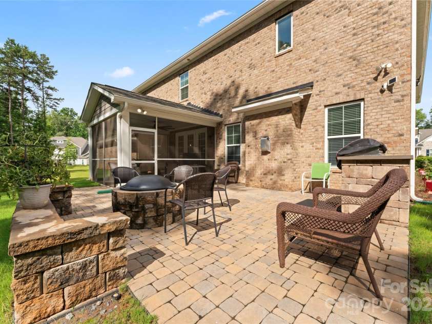 4008 Pinot Way, Fort Mill, SC 29707.  MLS# CAR4268803, YatesRealty ID 30944. View of stone fire pit, and pavers