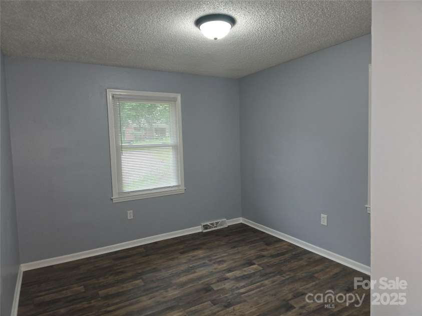 1660 Songwood Road, Concord, NC 28025.  MLS# CAR4268086, YatesRealty ID 30952. 2nd main level bedroom