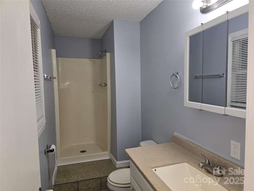 1660 Songwood Road, Concord, NC 28025.  MLS# CAR4268086, YatesRealty ID 30952. Primary Bathroom