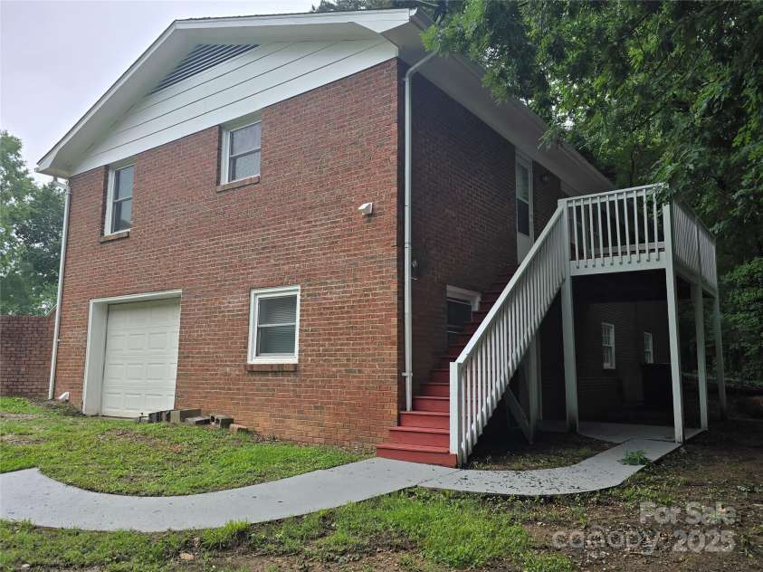 1660 Songwood Road, Concord, NC 28025.  MLS# CAR4268086, YatesRealty ID 30952. Rear corner