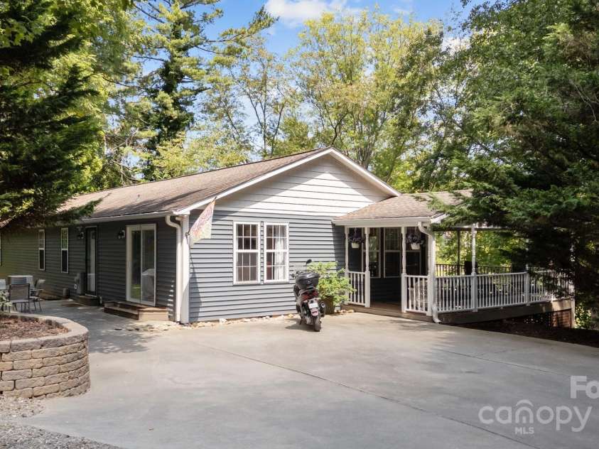 34 Edwards Street, Asheville, NC 28806.  MLS# CAR4268192, YatesRealty ID 30954. Driveway at the back of the house and entrance to the wrap around covered deck to the front door.