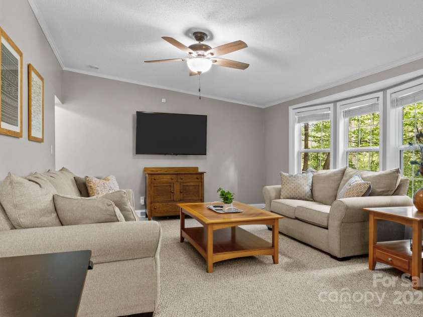 34 Edwards Street, Asheville, NC 28806.  MLS# CAR4268192, YatesRealty ID 30954. Enter from the front door and to the right is this huge living room with a window looking out toward the pretty yard and golf course.