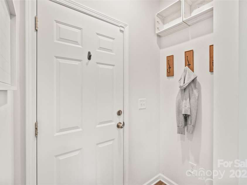 16726 Cozy Cove Road, Charlotte, NC 28278.  MLS# CAR4288880, YatesRealty ID 30958. A cozy nook off the garage that’s ideal for stashing shoes, bags, and everything in between.