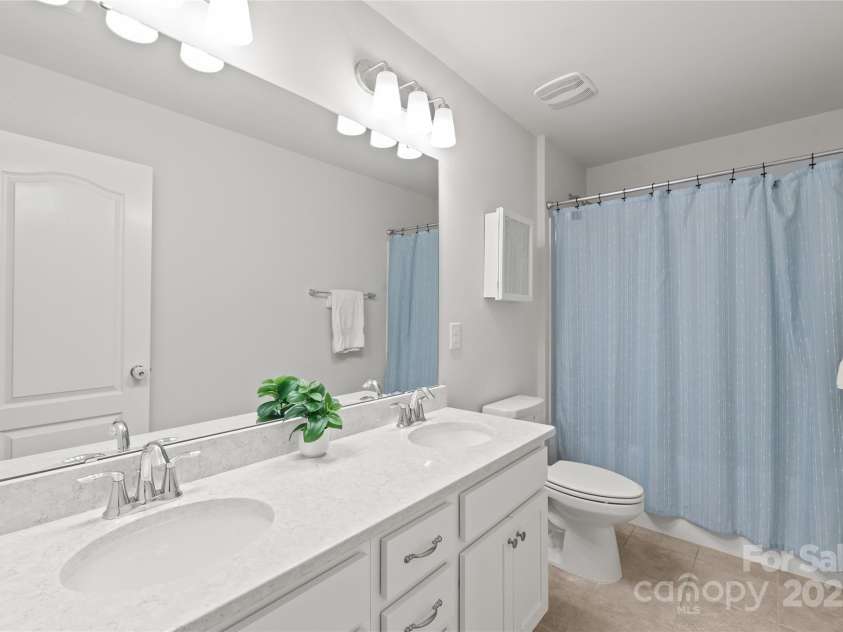 16726 Cozy Cove Road, Charlotte, NC 28278.  MLS# CAR4288880, YatesRealty ID 30958. A full bathroom thoughtfully located for easy access from Bedrooms 2 and 3.