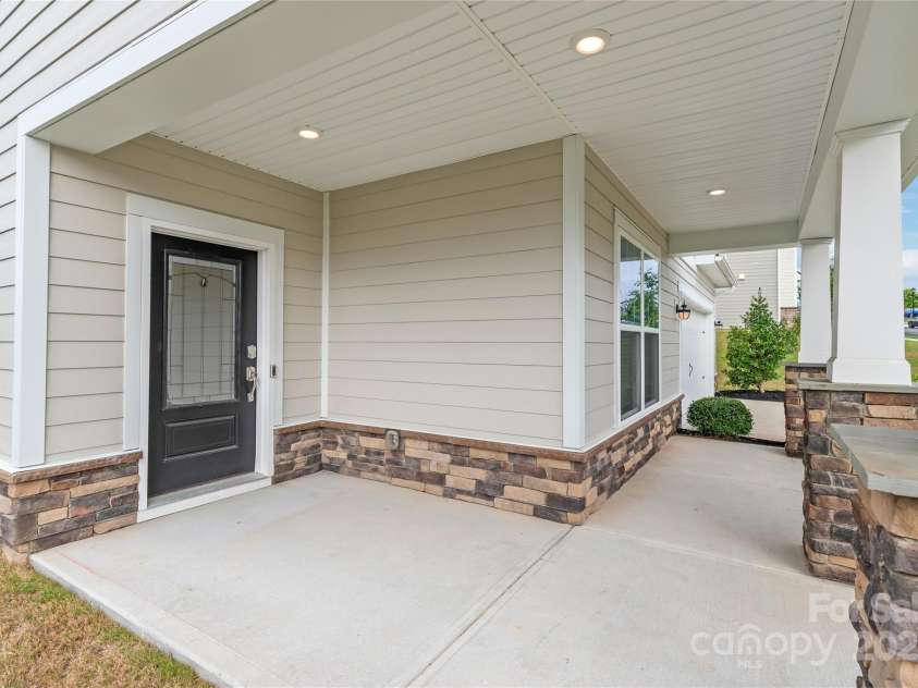16726 Cozy Cove Road, Charlotte, NC 28278.  MLS# CAR4288880, YatesRealty ID 30958. A welcoming entrance with stone pillars and durable cement siding that blends beauty with peace of mind.
