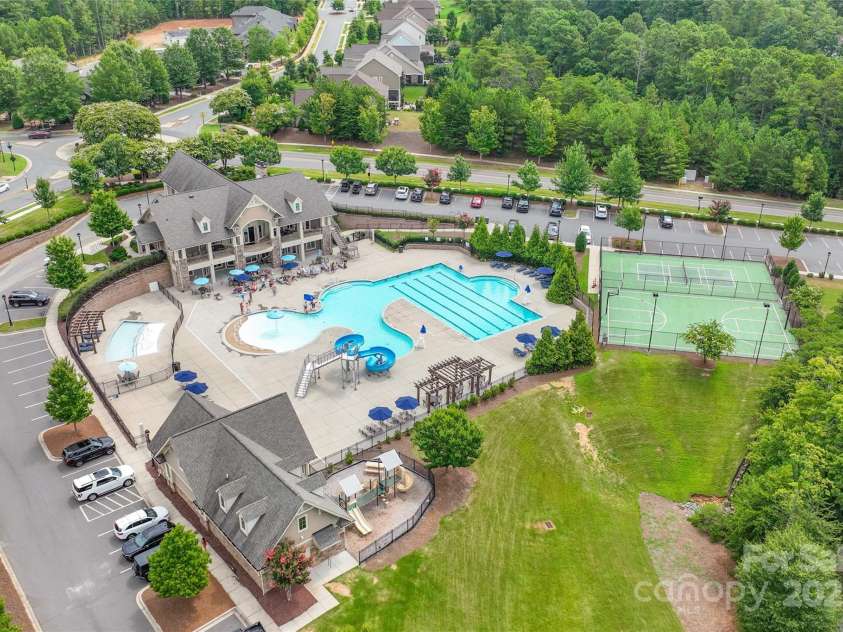16726 Cozy Cove Road, Charlotte, NC 28278.  MLS# CAR4288880, YatesRealty ID 30958. Beat the heat with a refreshing pool and waterslide—just one of the perks of living here.
