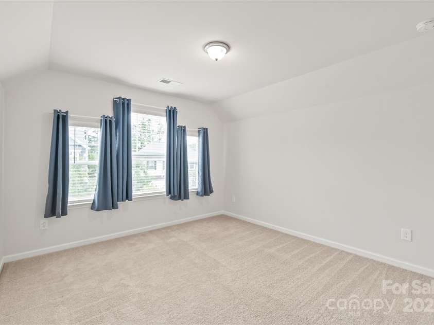 16726 Cozy Cove Road, Charlotte, NC 28278.  MLS# CAR4288880, YatesRealty ID 30958. Bedroom 2 offers a bright, inviting space perfect for family, guests, or a home office.