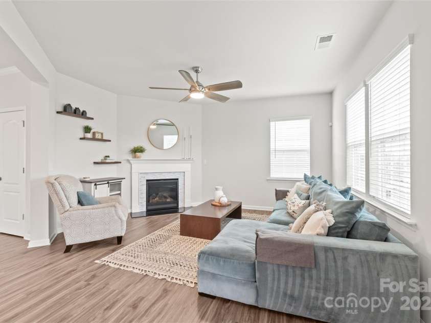 16726 Cozy Cove Road, Charlotte, NC 28278.  MLS# CAR4288880, YatesRealty ID 30958. Enjoy seamless flow from the kitchen to living room, where the fireplace creates a cozy focal point for family and friends.